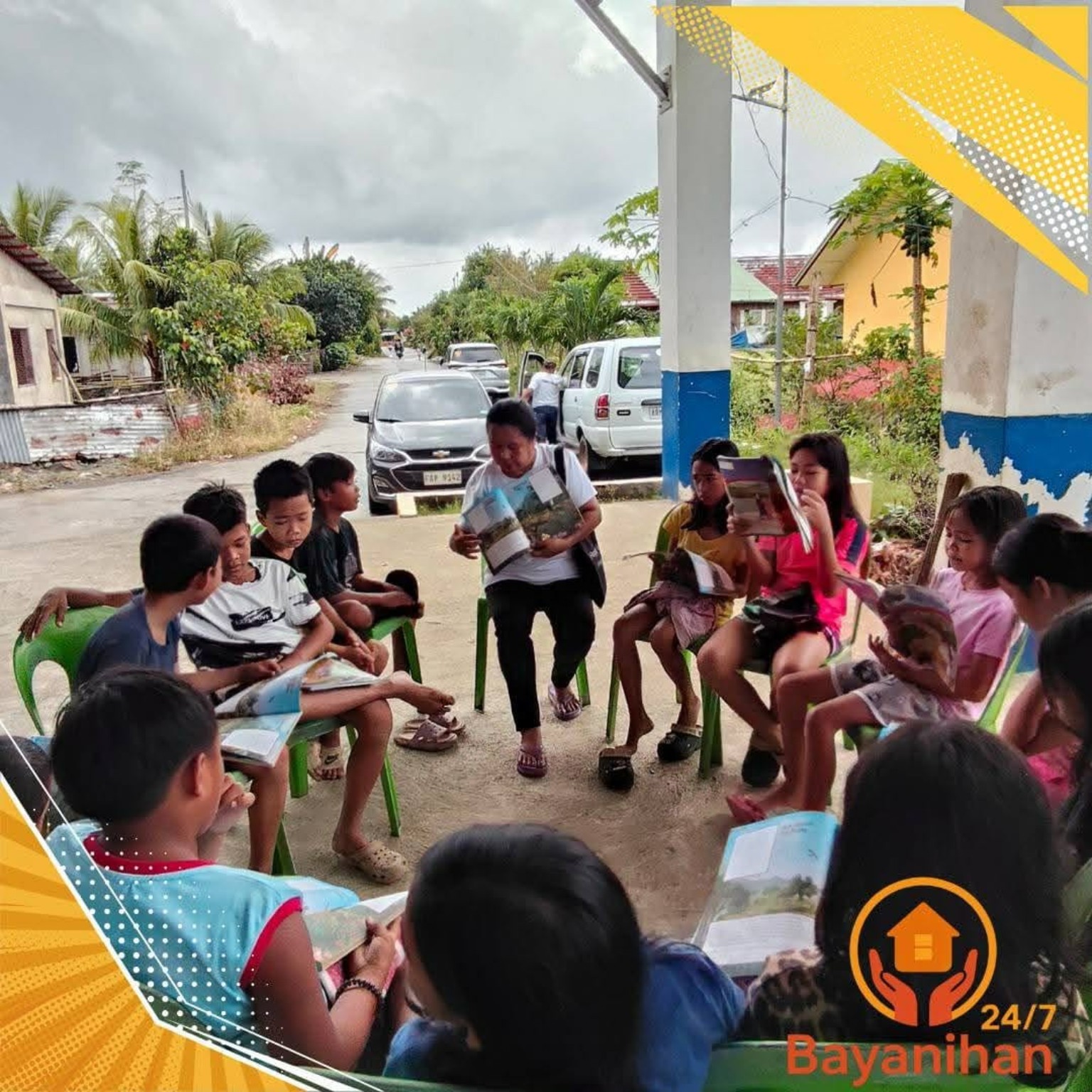 A volunteer sharing a lesson with children